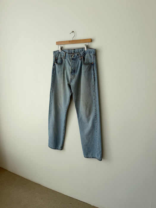Distressed Mid Wash Levi's 501 Denim | 34