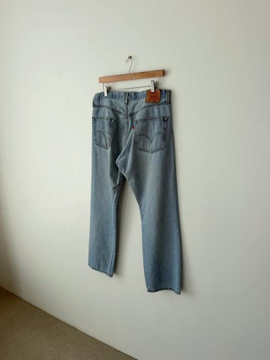 Distressed Mid Wash Levi's 501 Denim | 34